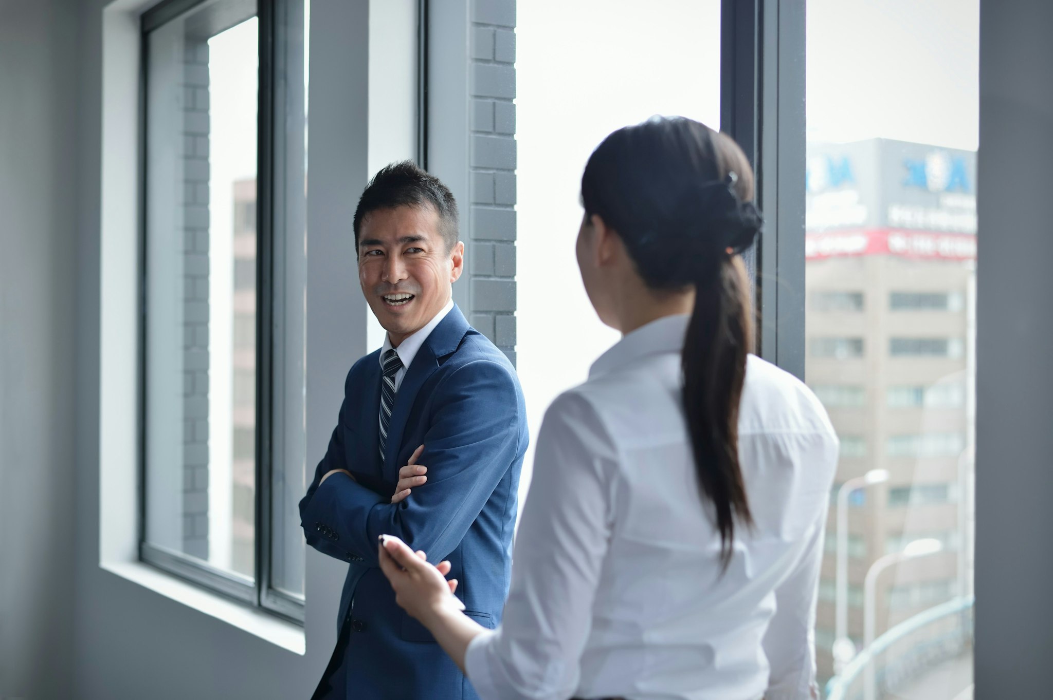 Two professionals discussing the state of Japan's AI regulations