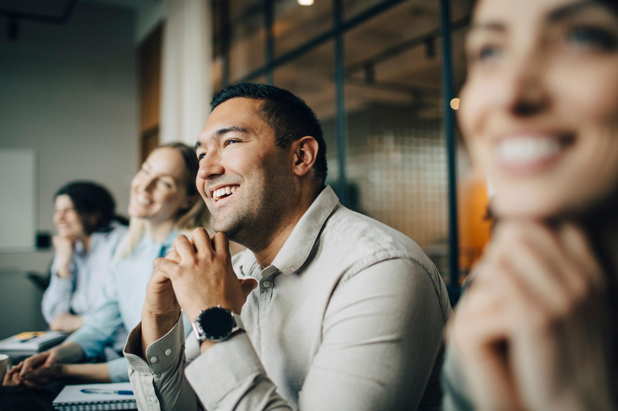 Employees discussing how to safeguard customer data during Data Privacy Week