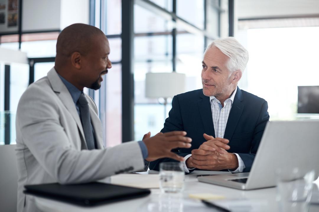 Executives at the C-suite level discussing a board report