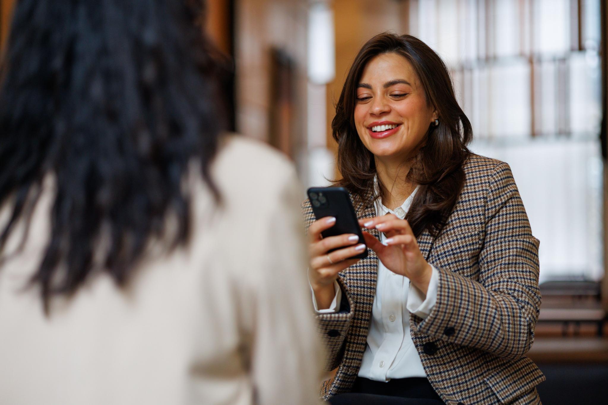 General counsel and corporate secretary reviewing governance information together during a meeting